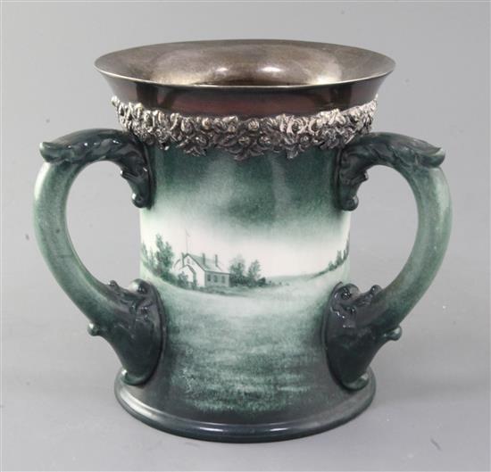 A Lenox Ceramic Art Company golf three handled mug, c.1905, height 6.5in., rim crack